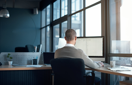 Cropped shot of a businessman working at his desk