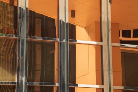 Security window film on a modern glass building by Pro Tint LLC