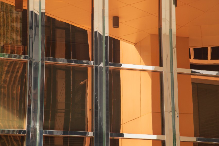 Security window film on a modern glass building by Pro Tint LLC